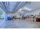 Two-car garage with storage shelves, organizational items, and an open garage door at 604 Stableford Ct., Myrtle Beach, SC 29577