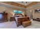 Large main bedroom with a comfortable bed, wood furniture, and an ensuite bathroom at 604 Stableford Ct., Myrtle Beach, SC 29577