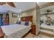Main bedroom with large bed, ceiling fan, sitting area and an attached room at 604 Stableford Ct., Myrtle Beach, SC 29577