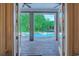 View of the backyard pool and patio area through open French doors at 604 Stableford Ct., Myrtle Beach, SC 29577