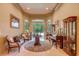 Sitting room with vintage furniture, piano, display cabinets, and backyard access at 604 Stableford Ct., Myrtle Beach, SC 29577