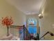 Elegant staircase leading to the second level with decorative window and chandelier at 604 Stableford Ct., Myrtle Beach, SC 29577