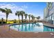 Outdoor pool with a bridge and palm trees at 6804 N Ocean Blvd. # 723, Myrtle Beach, SC 29572