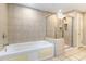 Clean bathroom with a jetted tub, glass shower, and tile flooring at 9994 Beach Club Dr. # 1604, Myrtle Beach, SC 29572