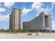 Beachfront view of two high-rise buildings and dunes at 9994 Beach Club Dr. # 1604, Myrtle Beach, SC 29572