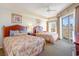 Bedroom with two beds, balcony access, ceiling fan and carpeted floors at 9994 Beach Club Dr. # 1604, Myrtle Beach, SC 29572
