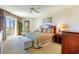 Bedroom with a king-size bed, balcony access, and ceiling fan at 9994 Beach Club Dr. # 1604, Myrtle Beach, SC 29572