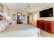 Bedroom with king-size bed, large TV, ceiling fan, and a walk-in closet at 9994 Beach Club Dr. # 1604, Myrtle Beach, SC 29572