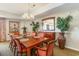 Dining area with wooden table, seating for eight, and decorative plants at 9994 Beach Club Dr. # 1604, Myrtle Beach, SC 29572