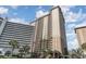 View of resort building against blue sky at 9994 Beach Club Dr. # 1604, Myrtle Beach, SC 29572