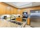 Bright kitchen features stainless steel appliances, granite countertops, and ample cabinet space at 9994 Beach Club Dr. # 1604, Myrtle Beach, SC 29572