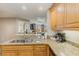 Kitchen with light wood cabinets, granite countertops, and stainless steel appliances at 9994 Beach Club Dr. # 1604, Myrtle Beach, SC 29572