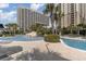 Inviting pool area with lounge chairs and palm trees at 9994 Beach Club Dr. # 1604, Myrtle Beach, SC 29572