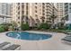 Community pool with lounge chairs and landscaping at 9994 Beach Club Dr. # 1604, Myrtle Beach, SC 29572