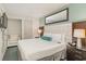 Comfortable bedroom with a queen-size bed and ensuite bathroom at 107 Ocean Blvd. S # 507, Myrtle Beach, SC 29577