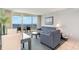 Living room with ocean view, sofa, and dining table at 107 Ocean Blvd. S # 507, Myrtle Beach, SC 29577