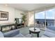 Living room with ocean view, sofa, and balcony access at 107 Ocean Blvd. S # 507, Myrtle Beach, SC 29577