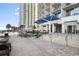 Resort-style pool deck with lounge chairs, shade structures, and ocean views at 107 Ocean Blvd. S # 507, Myrtle Beach, SC 29577