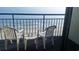 Balcony view with table, chairs, and ocean backdrop at 1105 S Ocean Blvd. # 830, Myrtle Beach, SC 29577