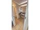 Bathroom vanity area with granite countertop, mirror, and tiled floor at 1105 S Ocean Blvd. # 830, Myrtle Beach, SC 29577
