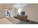Bedroom with bed, dresser, TV, and view of the kitchen at 1105 S Ocean Blvd. # 830, Myrtle Beach, SC 29577