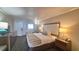 Hotel-style bedroom featuring a bed, nightstands, and a chair at 1105 S Ocean Blvd. # 830, Myrtle Beach, SC 29577