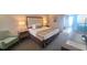 Hotel-style bedroom with a bed, nightstands, and a chair at 1105 S Ocean Blvd. # 830, Myrtle Beach, SC 29577