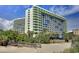Exterior view of a beachfront high-rise hotel with balconies at 1105 S Ocean Blvd. # 830, Myrtle Beach, SC 29577