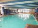 Large indoor pool with dolphin murals and ample natural light at 1105 S Ocean Blvd. # 830, Myrtle Beach, SC 29577