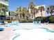 Winding lazy river pool with palm trees and lounge chairs at 1105 S Ocean Blvd. # 830, Myrtle Beach, SC 29577