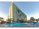 Outdoor pool with lounge chairs at Coral Beach Resort at 1105 S Ocean Blvd. # 830, Myrtle Beach, SC 29577
