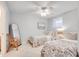 Light and airy bedroom with twin beds and a full-length mirror at 1620 N Waccamaw Dr. # 208, Murrells Inlet, SC 29576