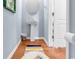 Powder room with pedestal sink and hardwood floor at 1857 Culbertson Ave. # 1857, Myrtle Beach, SC 29577