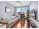 Relaxing bedroom with striped sofa and hardwood floors at 1857 Culbertson Ave. # 1857, Myrtle Beach, SC 29577