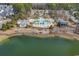 Community pool with clubhouse and surrounding landscape at 1857 Culbertson Ave. # 1857, Myrtle Beach, SC 29577