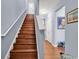 Wood staircase with white railing leading upstairs at 1857 Culbertson Ave. # 1857, Myrtle Beach, SC 29577