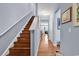 Wood staircase with white railing leading to second floor at 1857 Culbertson Ave. # 1857, Myrtle Beach, SC 29577