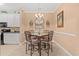 Dining area with a table and four chairs and adjacent to the kitchen at 2005 Silvercrest Dr. # G-32, Myrtle Beach, SC 29579