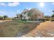 Condo building exterior with balconies, landscaping, and a lawn at 2005 Silvercrest Dr. # G-32, Myrtle Beach, SC 29579