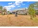 Spacious backyard with fire pit and screened porch at 317 Goddard Ln., Murrells Inlet, SC 29576