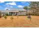 Spacious backyard with fire pit and screened porch at 317 Goddard Ln., Murrells Inlet, SC 29576