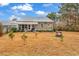 Spacious backyard with fire pit and screened porch at 317 Goddard Ln., Murrells Inlet, SC 29576