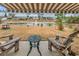 Relaxing patio overlooking pond with seating and fire pit at 317 Goddard Ln., Murrells Inlet, SC 29576
