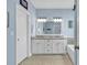 Double vanity bathroom with granite countertop and white cabinets at 317 Goddard Ln., Murrells Inlet, SC 29576