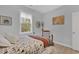 Bright bedroom featuring a queen bed and hardwood floors at 317 Goddard Ln., Murrells Inlet, SC 29576