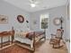 Charming bedroom with a queen bed and rocking chair at 317 Goddard Ln., Murrells Inlet, SC 29576