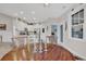 Round wooden dining table with chairs, located near kitchen at 317 Goddard Ln., Murrells Inlet, SC 29576