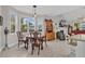 Bright dining area with a round table and chairs, adjacent to kitchen and living room at 317 Goddard Ln., Murrells Inlet, SC 29576