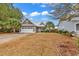 Attractive single-story home with a paved driveway and manicured lawn at 317 Goddard Ln., Murrells Inlet, SC 29576