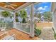 Inviting front porch with wooden flooring and white railings at 317 Goddard Ln., Murrells Inlet, SC 29576